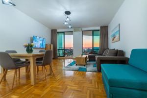 a living room with a table and a couch at Apartment Hanja in Bar