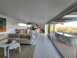 A seating area at Private villa with pool in Lajares