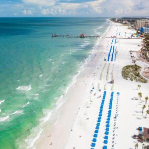 an aerial view of a beach with people and the ocean at The Avalon Club in Clearwater Beach