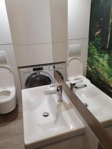 Koupelna v ubytování Apartament Hania