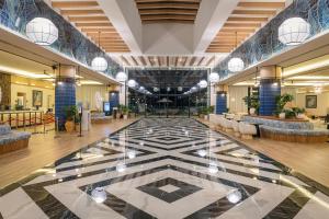 a lobby of a hotel with a large tile floor at Ocean Eden Bay - Adults Only - All Inclusive in Spring Rises