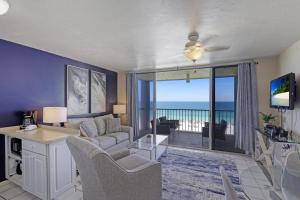 a living room with a view of the ocean at Apollo 502 in Marco Island