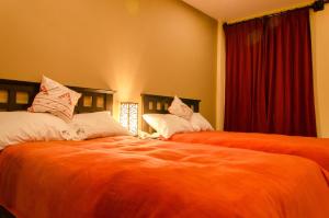 A bed or beds in a room at Cusco Bed and Breakfast
