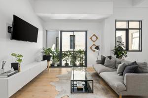 Μια τηλεόραση ή/και κέντρο ψυχαγωγίας στο Luxuria Apartments - Bourke