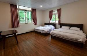 Voodi või voodid majutusasutuse Hongpeng Coffee Station Homestay toas
