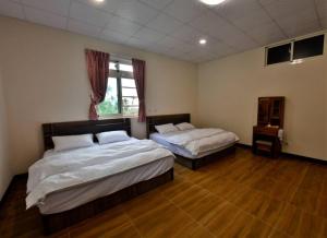 Katil atau katil-katil dalam bilik di Hongpeng Coffee Station Homestay