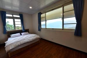 Voodi või voodid majutusasutuse Hongpeng Coffee Station Homestay toas