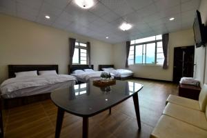 Voodi või voodid majutusasutuse Hongpeng Coffee Station Homestay toas