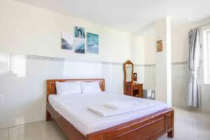 Кровать или кровати в номере Hoang Phat Hotel