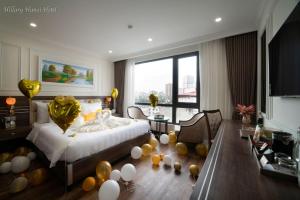 Voodi või voodid majutusasutuse Hillary Hanoi Hotel toas