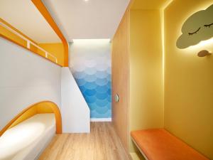 a childrens room with a staircase with a blue and white wall at Holiday Inn Resort Ho Tram Beach by IHG in Ho Tram
