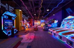 a room filled with lots of arcade games at Holiday Inn Resort Ho Tram Beach by IHG in Ho Tram