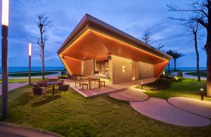 a small house with a view of the ocean at Holiday Inn Resort Ho Tram Beach by IHG in Ho Tram