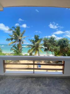 a view of the beach from the balcony of a house at La Polena in Matara