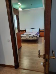 Voodi või voodid majutusasutuse Zhaylau Hotel toas