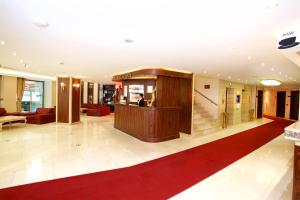 a lobby of a hotel with a person standing in the lobby at Mosaic Hotel Old City -Special Category in Istanbul