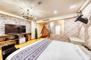 TV a/nebo společenská místnost v ubytování Hotel Lotus Morioka -Adult Only