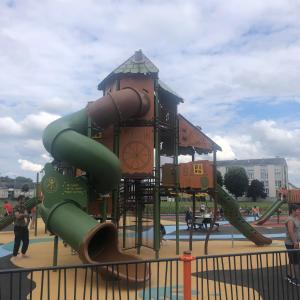 a playground with a slide in a park at LA PETITE MAISON DE TATATE in Longué