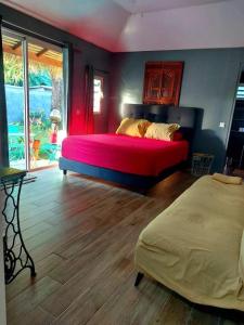Postel nebo postele na pokoji v ubytování Tokerau Tahiti
