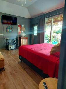 מיטה או מיטות בחדר ב-Tokerau Tahiti