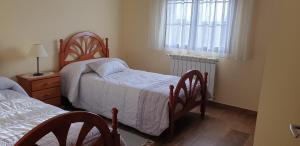 Postel nebo postele na pokoji v ubytování Casa Rural Las Canchaleras