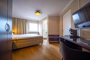 Postel nebo postele na pokoji v ubytování Fletcher Hotel-Restaurant Arion-Vlissingen