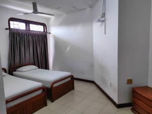 Giường trong phòng chung tại Wisma Hari Kota