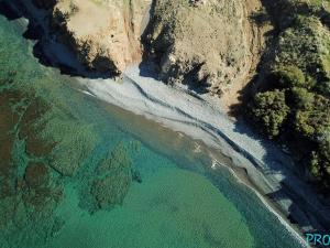 an aerial view of a beach with water and trees at Pomos Harbourbiew Villa in Pomos