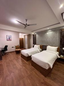 Giường trong phòng chung tại Clarks Inn , Airport Bangalore