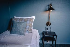 Postel nebo postele na pokoji v ubytování Trolltun Hotel & Hytter
