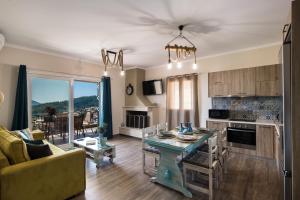 a kitchen and living room with a couch and a table at Casa De Blue in Kariá