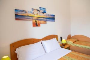 Кровать или кровати в номере Hotel La Mandorla