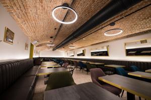 a row of tables and chairs in a restaurant at The Gold Bank in Prague