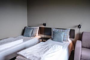Postel nebo postele na pokoji v ubytování Trolltun Hotel & Hytter