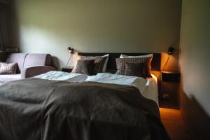 Postel nebo postele na pokoji v ubytování Trolltun Hotel & Hytter