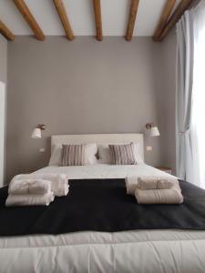 Letto o letti in una camera di Manno Rooms Affittacamere