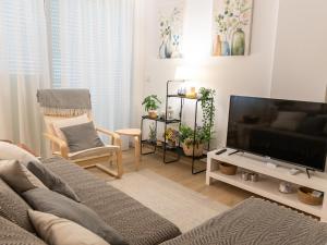 Televízia a/alebo spoločenská miestnosť v ubytovaní La Casa de Nano