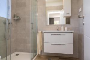 a bathroom with a sink and a shower at Villa Anita Kožino in Kožino +51 photos