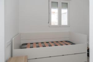 Postel nebo postele na pokoji v ubytování MIRALMAR del FARO, B-6-21