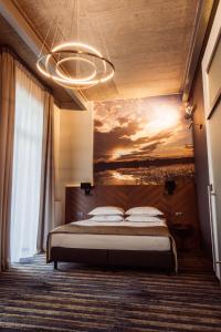 Łóżko lub łóżka w pokoju w obiekcie Hotel Loft 1898