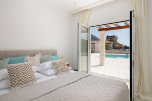 Posteľ alebo postele v izbe v ubytovaní Luxury Villa Salvina
