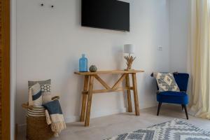Televízia a/alebo spoločenská miestnosť v ubytovaní Luxury Villa Salvina