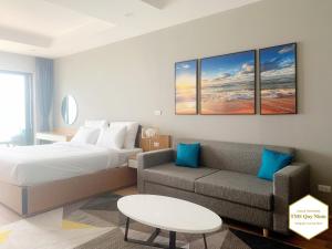 Giường trong phòng chung tại TMS Quy Nhơn Luxury Homestay