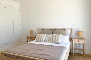 A bed or beds in a room at INFINITY Sunny Home by Cadiz4Rentals