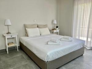 Posteľ alebo postele v izbe v ubytovaní PETRA RESIDENCES IN LINDOS