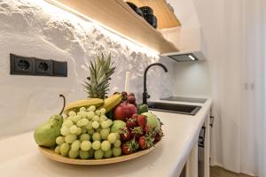 Kuchyň nebo kuchyňský kout v ubytování Mythos Luxury Suite