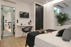 Postel nebo postele na pokoji v ubytování Mythos Luxury Suite