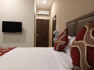 Postel nebo postele na pokoji v ubytování KB HOTEL