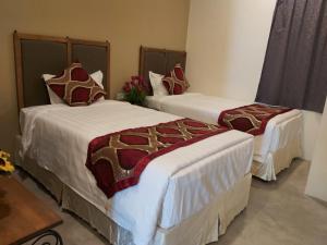 Postel nebo postele na pokoji v ubytování KB HOTEL