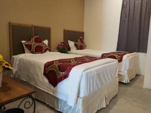Postel nebo postele na pokoji v ubytování KB HOTEL
